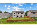 The home has a spacious, fenced backyard with a patio, fire pit, and a well-maintained lawn at 2509 Cedarmill Dr, Franklin, IN 46131