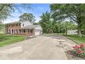 Brick home featuring a long drive leading to a detached garage and basketball hoop at 3030 E 236Th St, Cicero, IN 46034