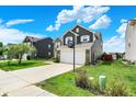 Inviting home with a basketball hoop over the garage, long driveway, and well-maintained lawn at 3284 Clary Blvd South Dr, Greenwood, IN 46143