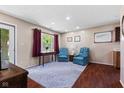 Cozy living room with matching chairs, wooden floors, and ample natural light at 3427 Donald Ave, Indianapolis, IN 46224