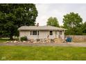Cozy single-story home featuring well-kept lawn and rock garden at 3431 W Mooresville Rd, Indianapolis, IN 46221