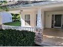 Inviting porch with brick columns, a white railing, and a view of the neighborhood at 3862 Cornwallis Ln, Carmel, IN 46032
