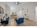 Living room featuring an open floor plan, hardwood floors and a kitchen bar area at 3926 Rosefinch Cir, Indianapolis, IN 46228