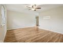 Spacious living room featuring hardwood floors and neutral paint at 410 E Southport Rd, Indianapolis, IN 46227