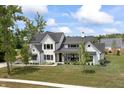 Elegant two-story home with a landscaped front yard and a covered porch for outdoor relaxation at 4808 Lakeview Dr, Greenwood, IN 46143