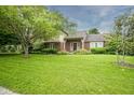 Beautiful home with a well-maintained lawn and mature trees in a desirable neighborhood at 4949 Jennings Dr, Carmel, IN 46033