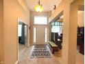 Bright foyer with tile flooring, open layout, and a view of the adjacent rooms at 5010 Cabrillo Dr, Plainfield, IN 46168