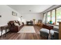 Bright living room featuring hardwood floors, a decorative fireplace, and ample natural light at 5631 N Olivia Dr, Alexandria, IN 46001
