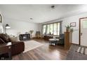 Comfortable living room with hardwood floors, a cozy seating area, and a large window at 5631 N Olivia Dr, Alexandria, IN 46001