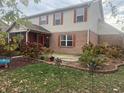 Backyard features garden beds, a screened in porch, and a patio area at 5698 Yorktown Rd, Plainfield, IN 46168