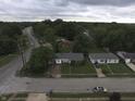 Neighborhood aerial view showcasing well-maintained homes, tree-lined streets and easy access to neighborhood amenities at 7929 Roy Rd, Indianapolis, IN 46219