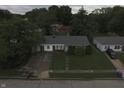 An aerial view of a charming single-story home in a neighborhood with mature trees and well-maintained lawns at 7929 Roy Rd, Indianapolis, IN 46219