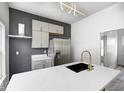 Close up of the modern kitchen with updated appliances and a sink in the island at 815 E 24Th E St, Indianapolis, IN 46205