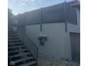 Exterior of a condo with stairs leading to upper floor and adjacent mailboxes at 8361 Paso Del Norte Ct, Indianapolis, IN 46227