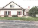 Charming home featuring classic architecture, well-kept lawn, and red shutters at 855 Gazebo Way # C, Greenwood, IN 46142