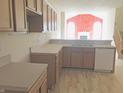 Kitchen with laminate countertops and white appliances at 855 Gazebo Way # C, Greenwood, IN 46142