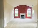 Spacious living room with fireplace and large windows allowing plenty of natural light at 855 Gazebo Way # C, Greenwood, IN 46142
