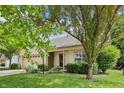 Charming one-story home with a well-manicured lawn and a two car garage, perfect for a Gathering at 110 Avon Ln, Noblesville, IN 46062