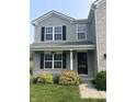 Inviting front porch with decorative plants and stylish number display at 1287 Highland Lake Way, Brownsburg, IN 46112
