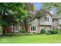 Charming home featuring a combination of brick and siding, a well-kept lawn, and mature trees at 13297 Highland Springs Dr, McCordsville, IN 46055