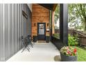 Inviting front porch with sleek furniture and stylish decor, enhancing curb appeal at 1620 W New York St, Indianapolis, IN 46222