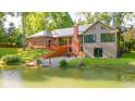A peaceful waterfront view with a cozy deck, perfect for relaxation by the pond, enhanced with solar panels at 1633 W 200 North, Greenfield, IN 46140