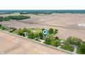 An aerial view of residential properties surrounded by farm land at 1891 W 300 N, Anderson, IN 46011