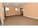 Bright living room featuring neutral colored walls and carpet flooring at 2622 Ethel Ave, Indianapolis, IN 46208