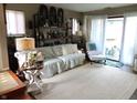 Cozy living room featuring a comfortable couch and bright, natural light from sliding doors at 2931 Eagles Crest Cir, Indianapolis, IN 46214