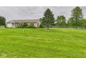 Ranch-style home boasting a well-manicured lawn, inviting curb appeal, and a one-car garage at 3387 S County Road 250 W, Danville, IN 46122