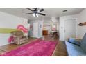 Open living room with hardwood floors, an area rug, and dining area at 4125 Bowman Ave, Indianapolis, IN 46227