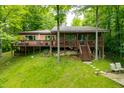 Inviting lake house with a spacious deck, perfect for enjoying the serene views and natural beauty at 429 E Hoover Dr, Nineveh, IN 46164