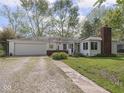 Exterior of home, with garage, and lawn at 4305 Clinton St, Lawrence, IN 46226