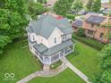 Classic two-story home with a charming wrap-around porch and well-maintained yard at 4526 Iowa St, Clayton, IN 46118