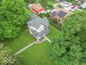 Aerial view of a charming two-story home with a green roof and well-manicured lawn at 4526 Iowa St, Clayton, IN 46118
