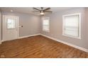 Inviting living room featuring abundant natural light, wood flooring, and neutral walls at 4933 W 13Th W St, Speedway, IN 46224