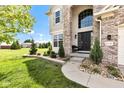 Inviting entryway showcases manicured landscaping, a charming front door, and elegant stone accents at 515 Lynton Way, Westfield, IN 46074
