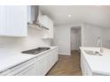 Bright kitchen featuring white cabinets, countertops, stainless steel appliances, and modern fixtures at 569 Dalton Way, Avon, IN 46123