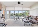 Relaxing sunroom with lake views, comfortable seating, and abundant natural light at 6760 Spirit Lake Dr # 201, Indianapolis, IN 46220