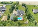 Spacious property with a private in-ground pool, fenced backyard, and mature trees creating a private oasis at 7221 State Road 42, Martinsville, IN 46151