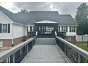 A long deck leads to the house and the covered patio at 7221 State Road 42, Martinsville, IN 46151