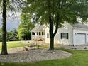 Two-story home featuring a side-entry garage and decorative rock landscaping at 7221 State Road 42, Martinsville, IN 46151