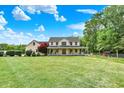 Classic two-story home featuring a spacious front yard, large trees, and inviting front porch at 7380 N 225 W, Lebanon, IN 46052