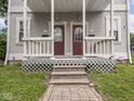 Inviting front porch showcasing dual entrances, classic railings, and a welcoming entry to each residence at 914 English Ave, Indianapolis, IN 46203
