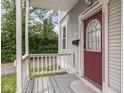 Charming entryway featuring a covered porch, decorative door with glass, and cozy outdoor space at 914 English Ave, Indianapolis, IN 46203