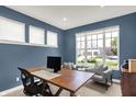 Comfortable office space with natural light and a large wooden desk at 15023 Glenmoor Cir, Carmel, IN 46033