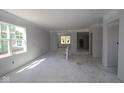 Spacious living room features abundant natural light, open layout, and neutral walls, perfect for creating a welcoming atmosphere at 1813 Real St, Indianapolis, IN 46240