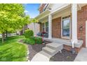 Inviting front porch with charming chairs and colorful flower boxes, showcasing curb appeal at 1821 Midnight Pass, Brownsburg, IN 46112