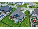 Aerial view of a home with an in-ground hot tub, manicured lawn, and privacy fence at 18398 Cross Lakes Ct, Westfield, IN 46074
