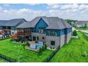 Gorgeous home featuring an outdoor screened deck, patio, and hot tub at 18398 Cross Lakes Ct, Westfield, IN 46074